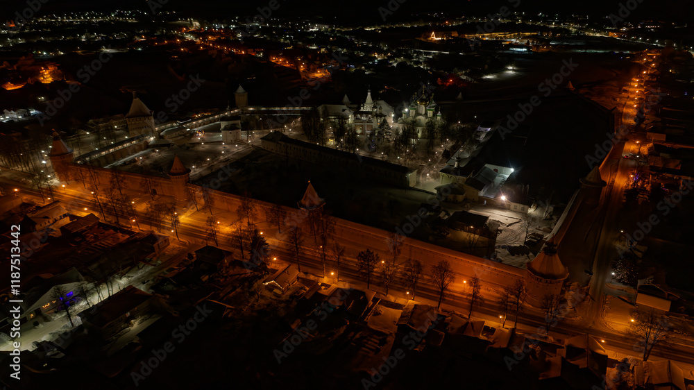 Fototapeta premium City at night with a large building in the center