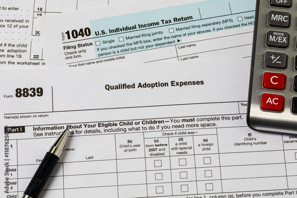 Qualified adoption expenses income tax form. Adoption tax credit, deduction and tax return concept. Qualified adoption expenses income tax form. Adoption tax credit, deduction and tax return concept.
