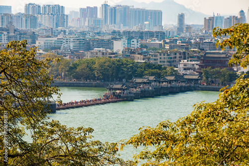 Through the trees from Hanwengong Shrine, dedicated to Han Yu, the Guangji Bridge over the Han River reveals a picturesque and serene view. photo