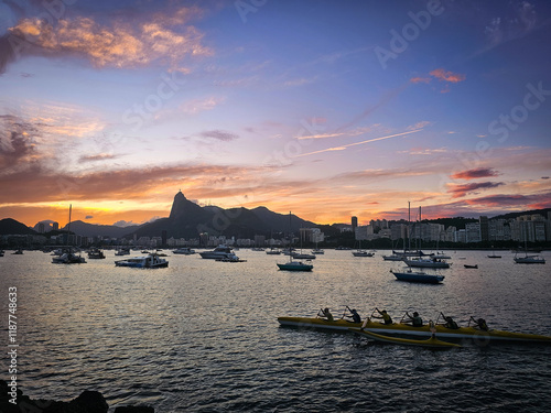Tablou pe pânză Rowing at Sunset in Guanabara Bay with Corcovado Silhouette - Rio de Janeiro, Br