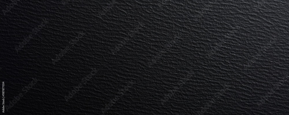 Textured black surface background with subtle waves and soft lighting Textured black surface background with subtle waves and soft lighting