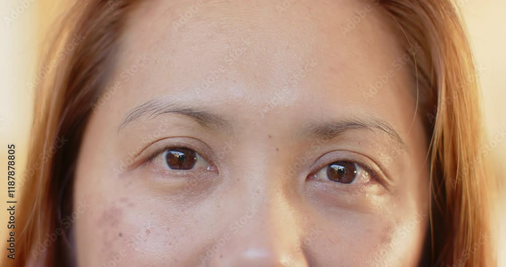 Close-up of mature woman eyes, showing natural beauty and aging gracefully Close-up of mature woman eyes, showing natural beauty and aging gracefully