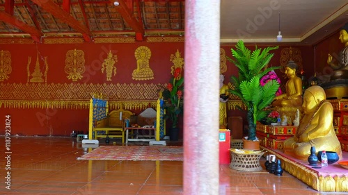 Explore the serene atmosphere of Yunnan Xishuangbanna Manfeilong Golden Pagoda Buddha statue and its stunning interior decor photo