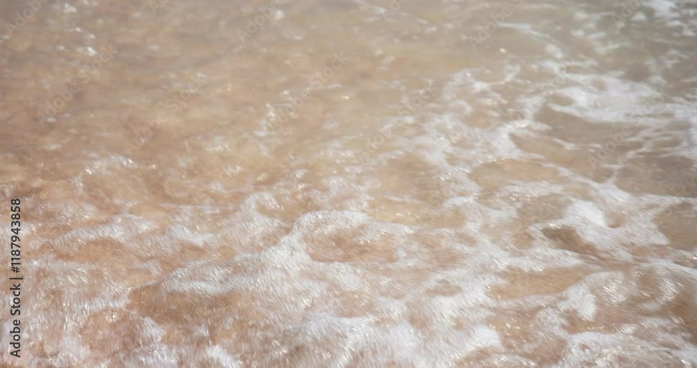 A wave on a white sand beach in Bamboo Island, Thailand A wave on a white sand beach in Bamboo Island, Thailand