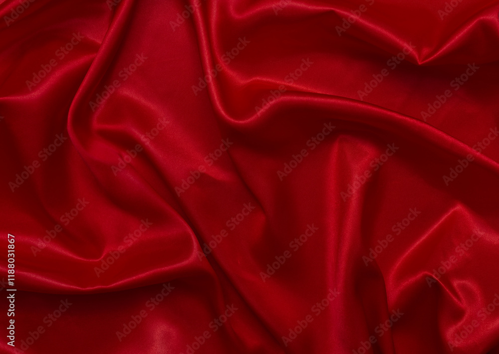 The top view of the red satin surface looks luxurious and beautiful. with sparkling waves Abstract background design copy space Card or banner (blurred or blurry) The top view of the red satin surface looks luxurious and beautiful. with sparkling waves Abstract background design copy space Card or banner (blurred or blurry)