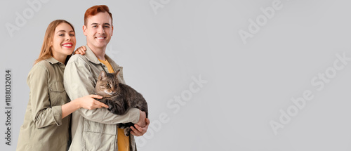 Young couple with cute cat ...