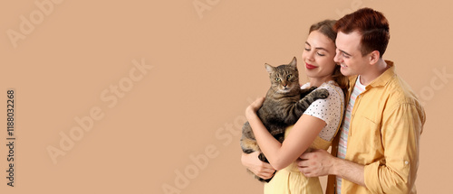 Young couple with cute cat ...