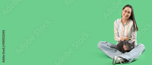 Young woman brushing cute B...