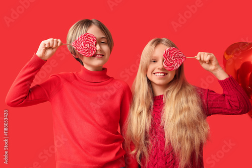 Little children with lollip...