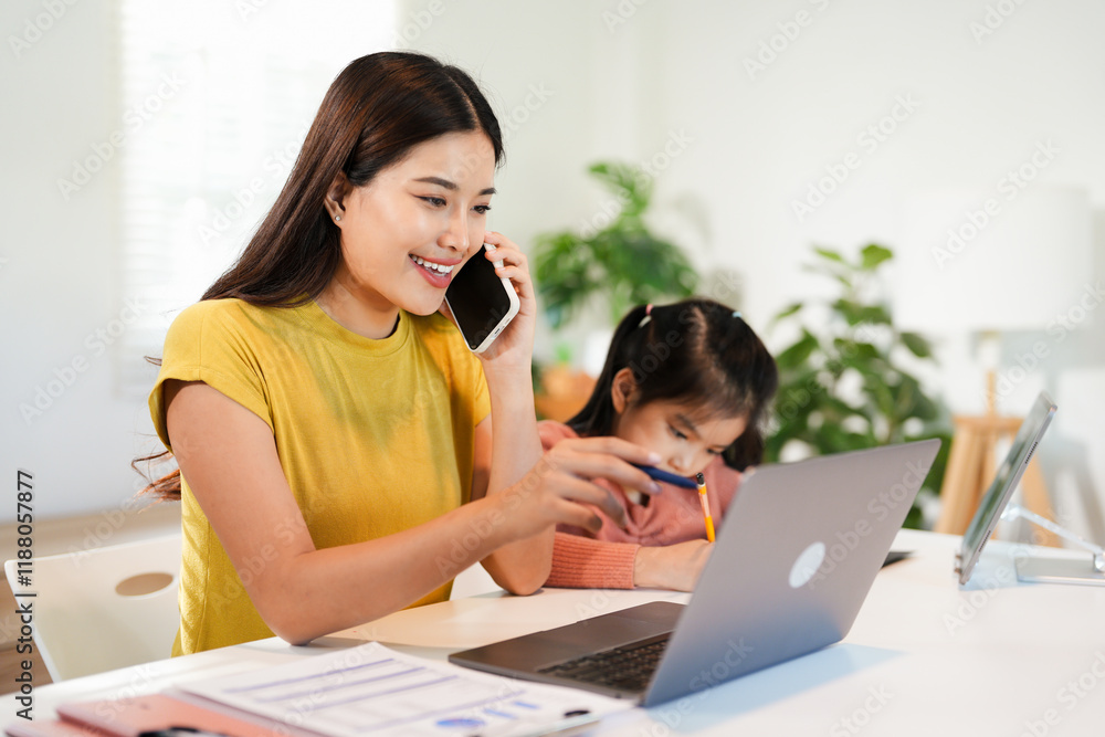 Mom working from home with distance learning child, multitasking childcare and work life balance . Single parent or mother and girl busy on laptop notebook and education Mom working from home with distance learning child, multitasking childcare and work life balance . Single parent or mother and girl busy on laptop notebook and education