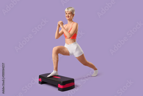 Young woman exercising with...
