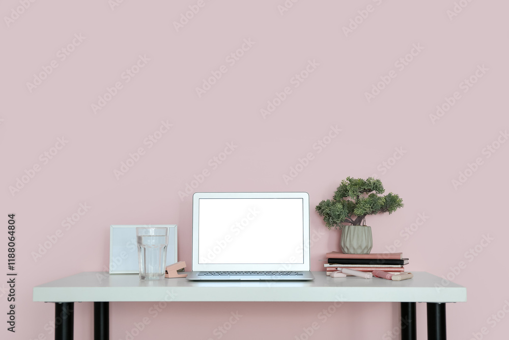 Fototapeta premium Stylish workplace with houseplant and laptop in office