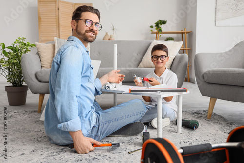 Father and son assembling f...