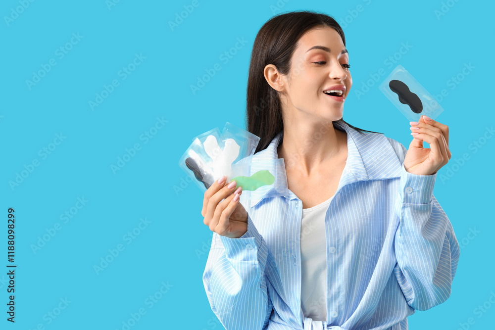 Young woman with nose patches on blue background Young woman with nose patches on blue background