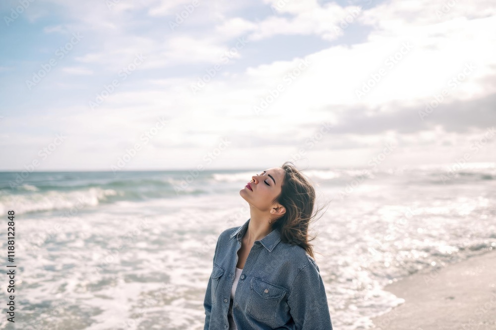 Woman with eyes closed standing by sea at beach Woman with eyes closed standing by sea at beach