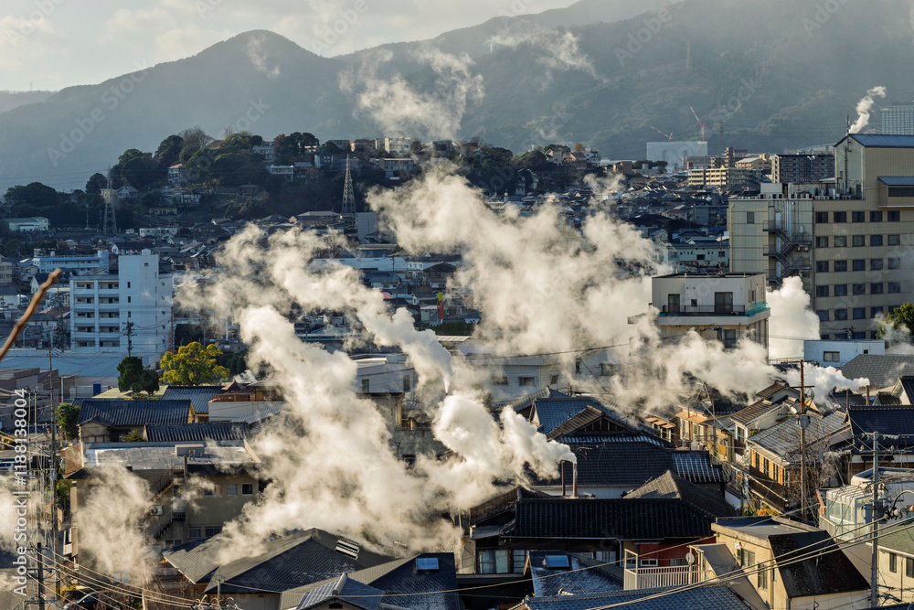 Beppu cityscape with Steam drifted from public hot spring baths and ryokan onsen background, Beppu, Oita, Kyushu, Japan.