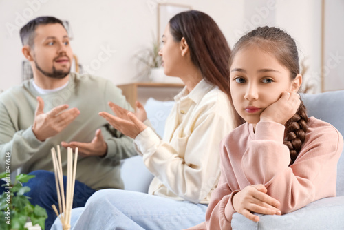 Sad little girl with parent...