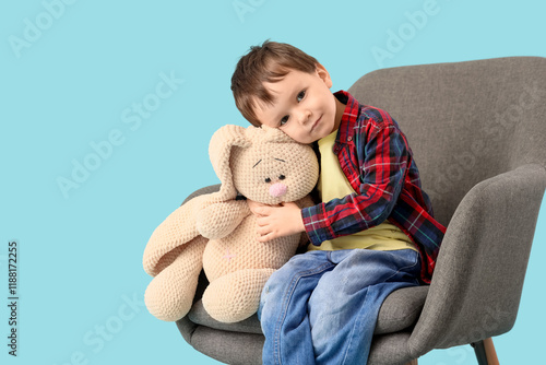Cute little boy hugging toy...
