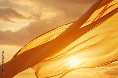 Flowing fabric dances in golden sunlight, creating warm, etherea photo