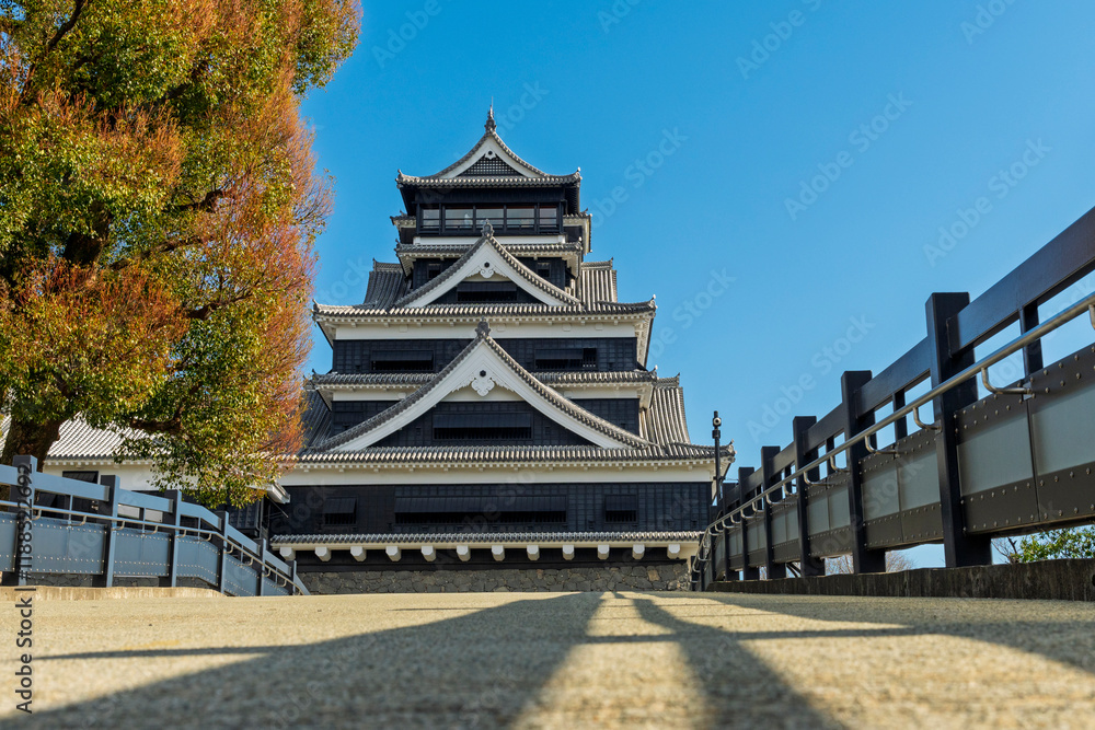 Tourist take photo Kumamoto Castle view from terrace and balcony in sunny blue sky day, Kumamoto, Japan.. the Kumamoto castle was a large and well-fortified castle.