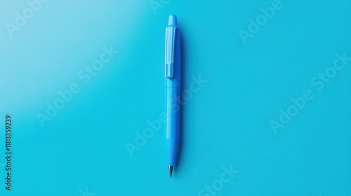 Obraz na płótnie Vibrant blue click pen resting on a simple background, showcasing its sleek design and functionality. w salonie
