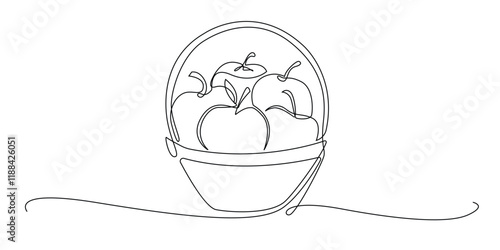 continuous line drawing of apples in a basket.one line drawing of harvest of apples.several apples in a basket.single line vector illustration.isolated white background