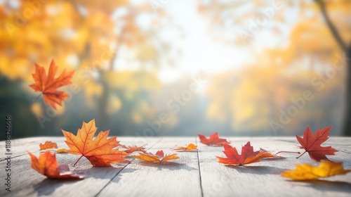 Fototapeta Naklejka Na Ścianę i Meble -  Rustic wooden table top with autumn leaves. Bright fall colors. Defocused background. Empty space for product placement. Suitable for banners, posters marketing visuals. Perfect for autumn themes.