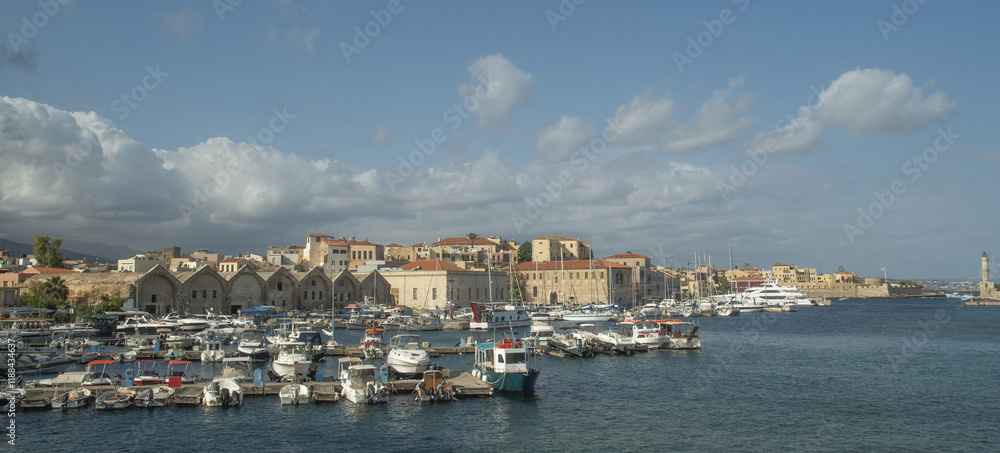 Fototapeta premium Coastline of old town Chania with port, lighthouse and fortress venetian Firka in Crete, Greece
