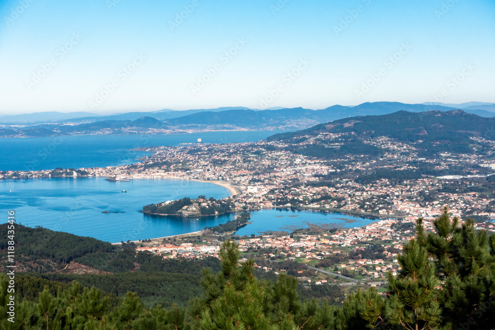 Fototapeta premium Beautiful view of the mouth of the Miñor River and Baiona Bay from the Cortelliño viewpoint in A Groba. Rias Baixas, Galicia, Spain.