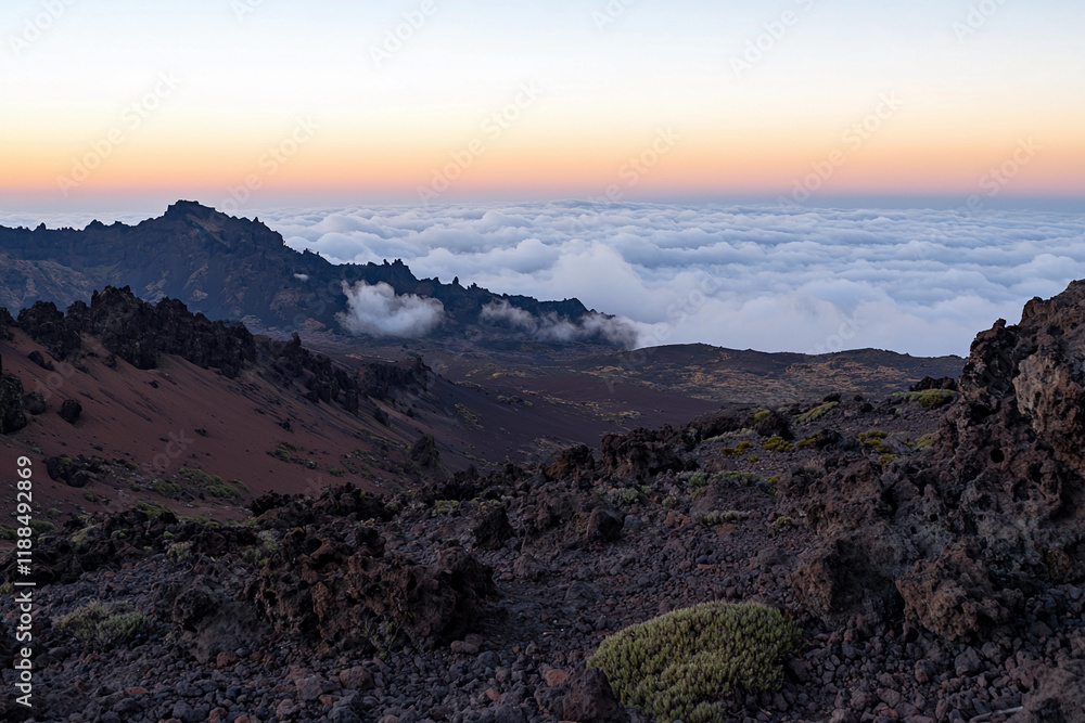 Obraz premium Dramatic dawn over rocky landscape and clouds