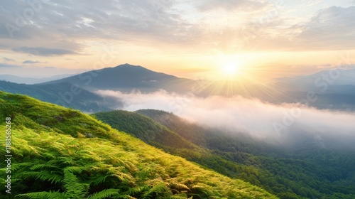 A view of the sun setting over a mountain range