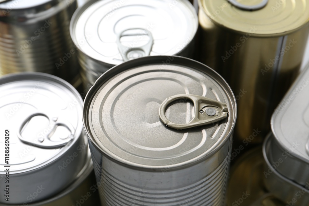 Many closed tin cans as background, closeup Many closed tin cans as background, closeup