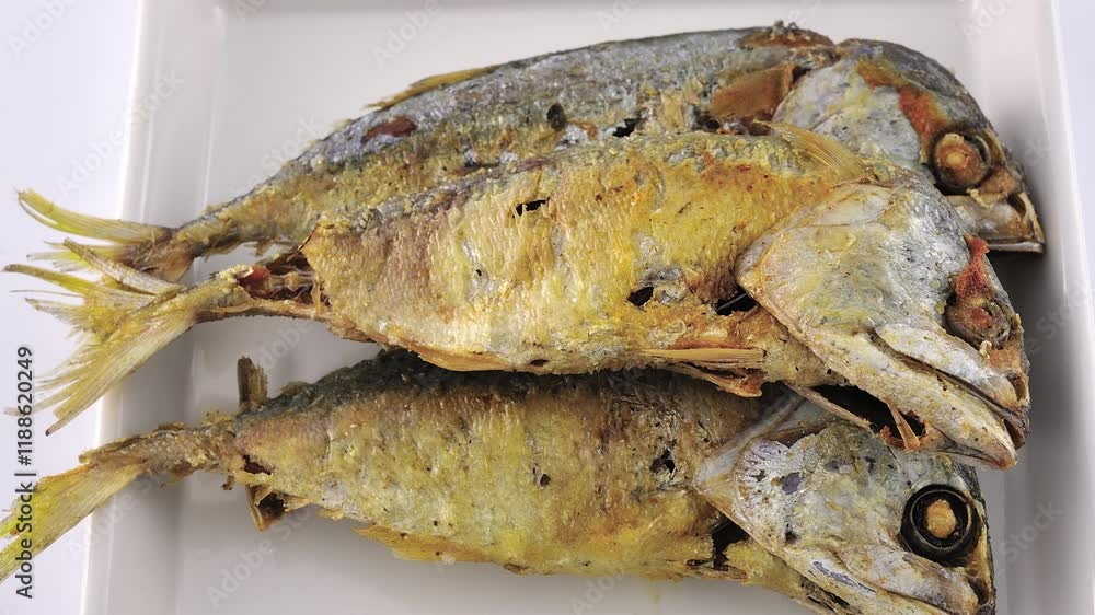Fried mackerel on a plate Fried mackerel on a plate