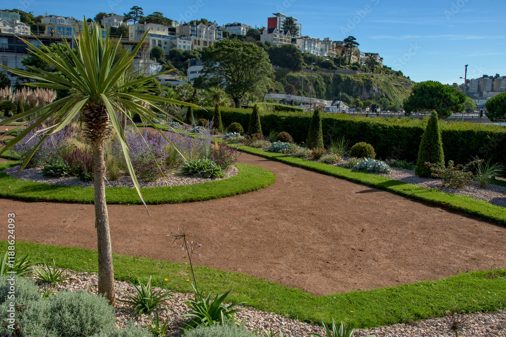 Obraz premium Italian gardens at Torre Abbey Park and meadows. Landmark tourist attraction Tropical palms, Mediterranean plants showcase the English Riviera. 