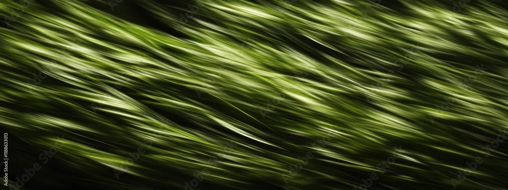 Captivating close-up of green grass leaves in blurred motion against a dark background, showcasing nature's texture and movement Captivating close-up of green grass leaves in blurred motion against a dark background, showcasing nature's texture and movement