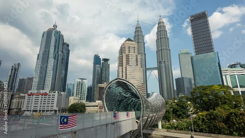 Kuala Lumpur, Malaysia, August 29, 2024: Moving camera of time-lapse video of the iconic Saloma Link and Twin Towers in Kuala Lumpur, Malaysia, Asia Travel Tourism. Timelapse.