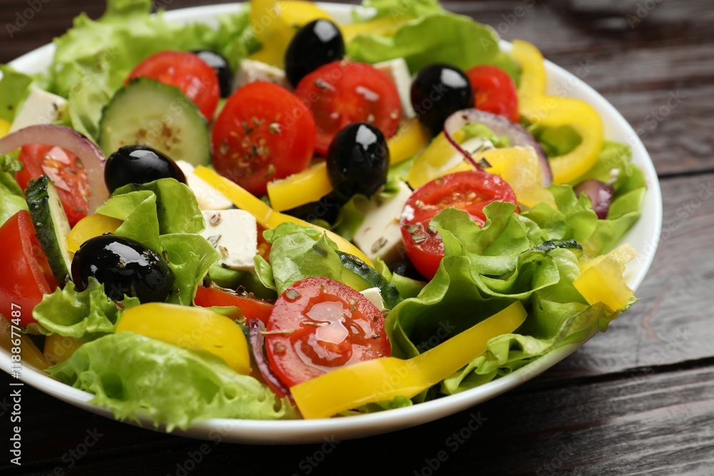 Delicious fresh Greek salad on wooden table, closeup Delicious fresh Greek salad on wooden table, closeup