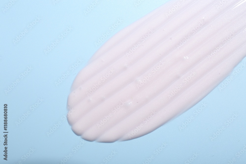 Cream sample on light blue background, top view Cream sample on light blue background, top view