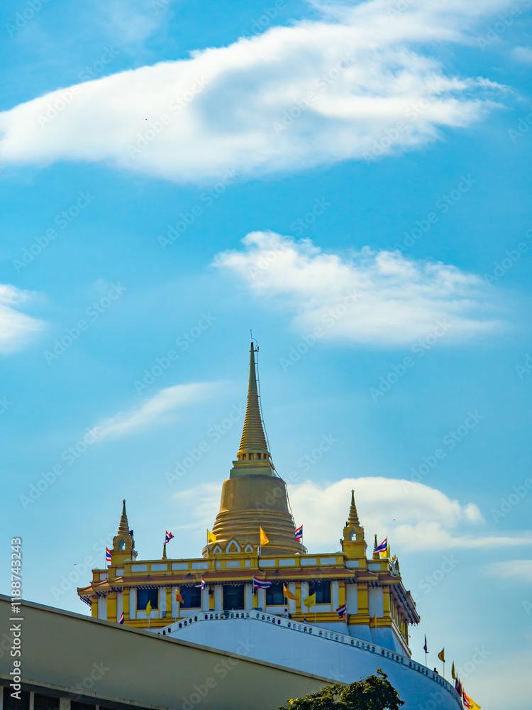 Naklejka premium Temple (Wat Phu Khao Thong), ancient art, standing tall on a mountain, located in Bangkok, Thailand.