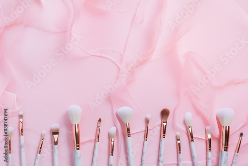 Makeup brushes, soft pastel pink background, cosmetic tools, beauty accessories, flat lay photography, minimalist composition, white powder puffs, professional makeup kit, beauty blogger setup, femini photo