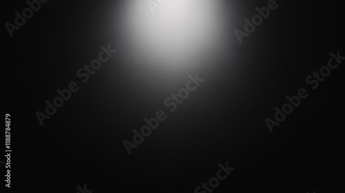 Bright spotlight on dark background.
