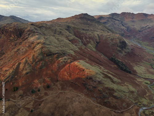 Beautiful aerial drone landscape image of Blea Tarn and Langdale Valley in Lake District during vibrant Autumn sunrise photo