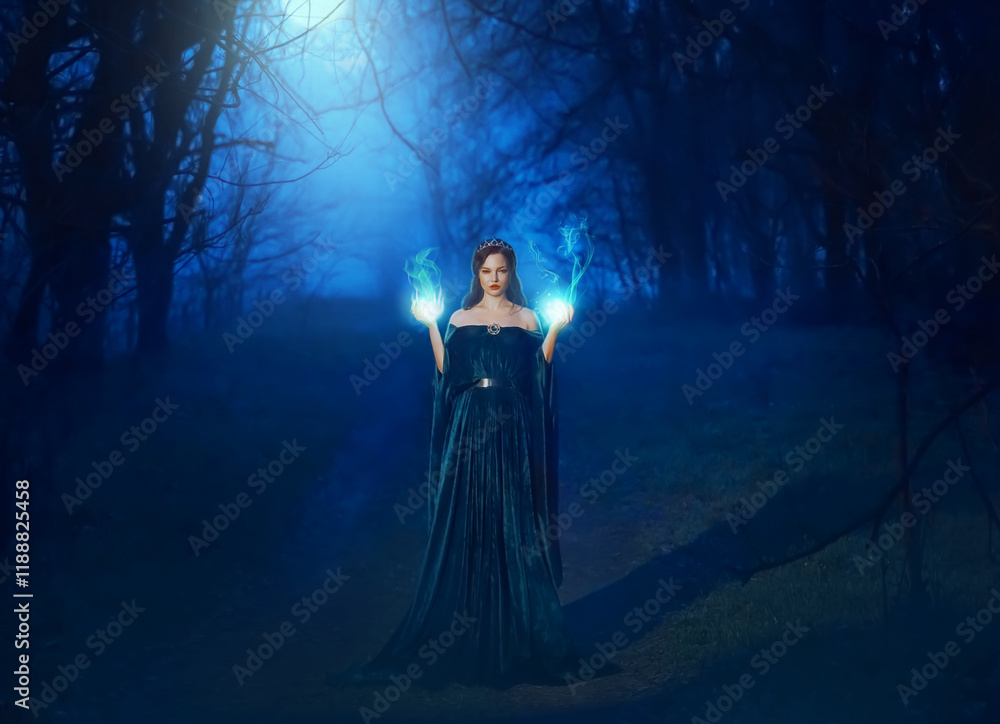 Mystic beauty woman evil witch in dark night fog forest blue moon light. Hands burning magic spell fire. Vampire queen demon power face. Vintage medieval dress cape. Scary Lady Halloween style clothes