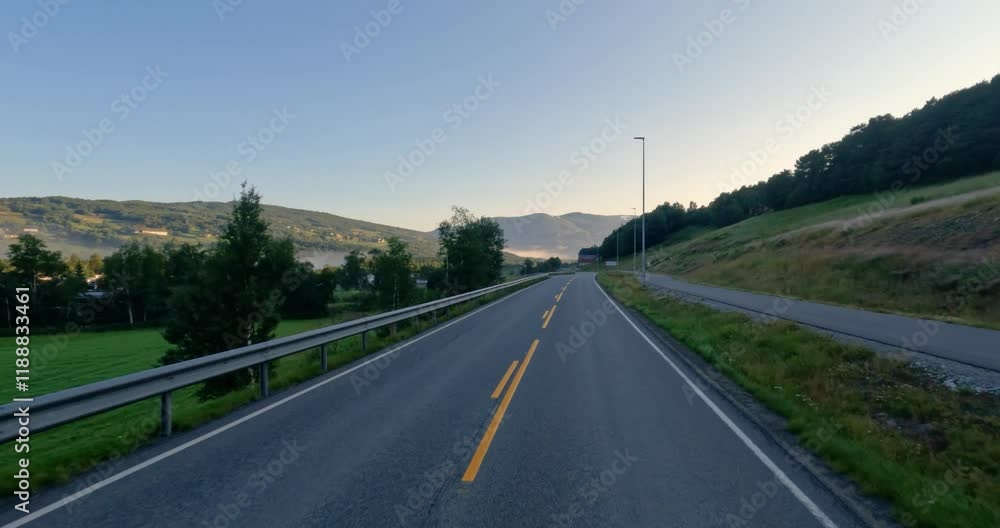 Driving a Car on a Road in Norway. Driving a Car on a Road in Norway.