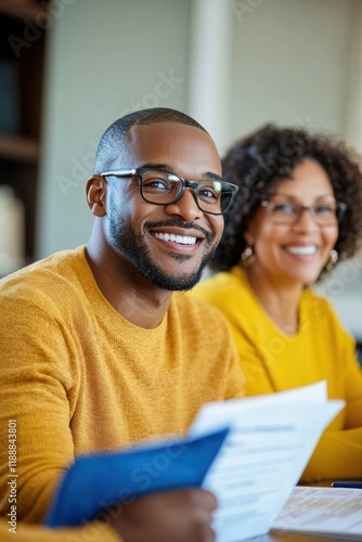 Wallpaper Mural Smiling Man in Glasses Sitting in a Meeting with Colleagues Torontodigital.ca