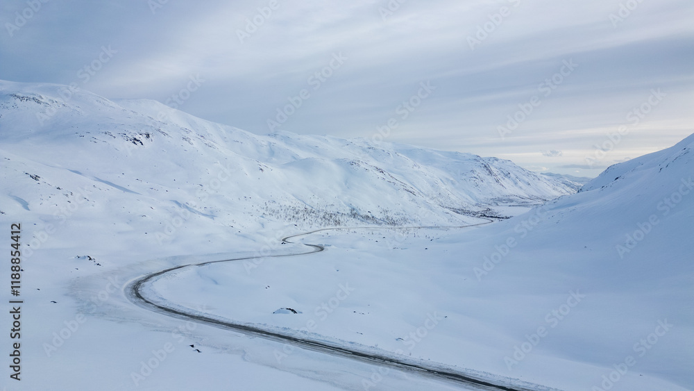Mountain road covered in snow in winter, aerial view Mountain road covered in snow in winter, aerial view