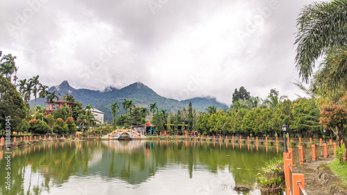 A large swimming pool with mountain views in Singkawang, West Kalimantan photo