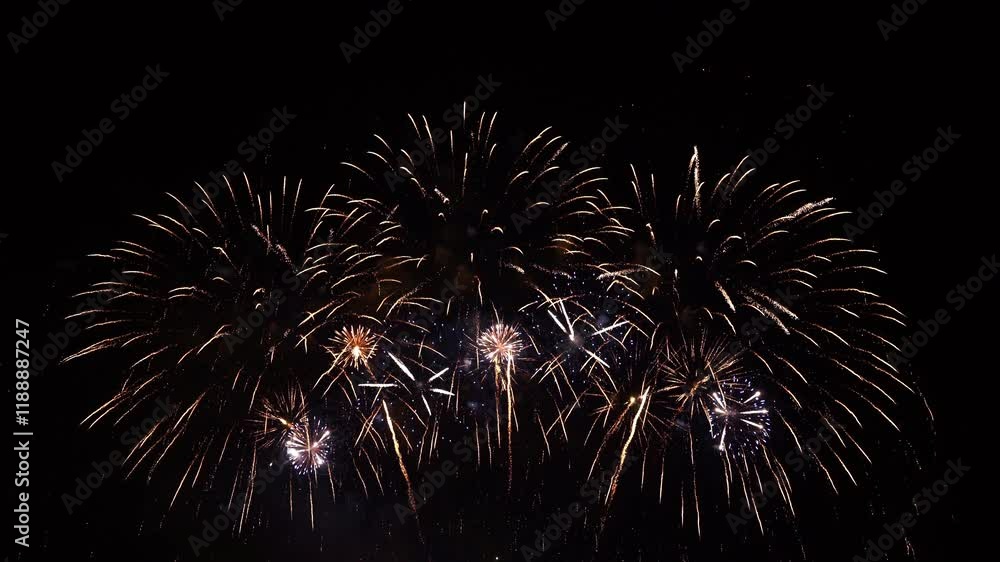 Real fireworks background. Firework Display, abstract blur of real golden shining fireworks lights at night sky. glowing fireworks show. Firework Explosive Material. New year's eve fireworks Real fireworks background. Firework Display, abstract blur of real golden shining fireworks lights at night sky. glowing fireworks show. Firework Explosive Material. New year's eve fireworks