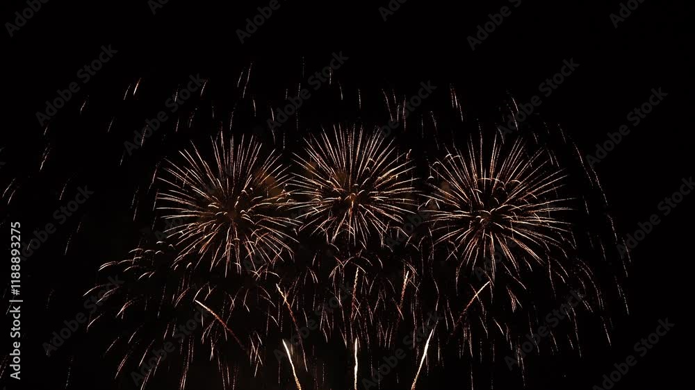 Real fireworks background. Firework Display, abstract blur of real golden shining fireworks lights at night sky. glowing fireworks show. Firework Explosive Material. New year's eve fireworks Real fireworks background. Firework Display, abstract blur of real golden shining fireworks lights at night sky. glowing fireworks show. Firework Explosive Material. New year's eve fireworks
