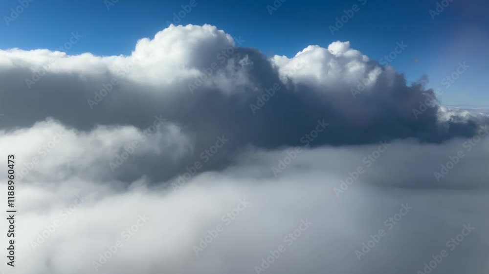 Сumulus clouds against sky, side view from an airplane window